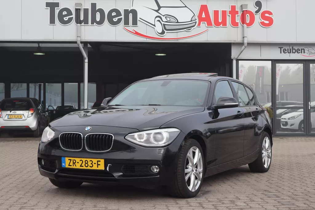 BMW 1-serie 118i Executive | Schuif-/kanteldak | Xenon | Parkeersensoren | Climate control